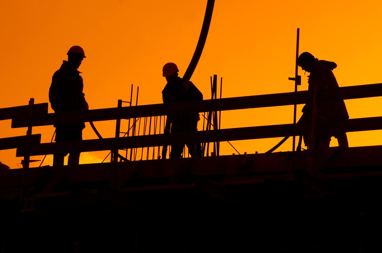 Construction crew installing a new roof on a suburban home