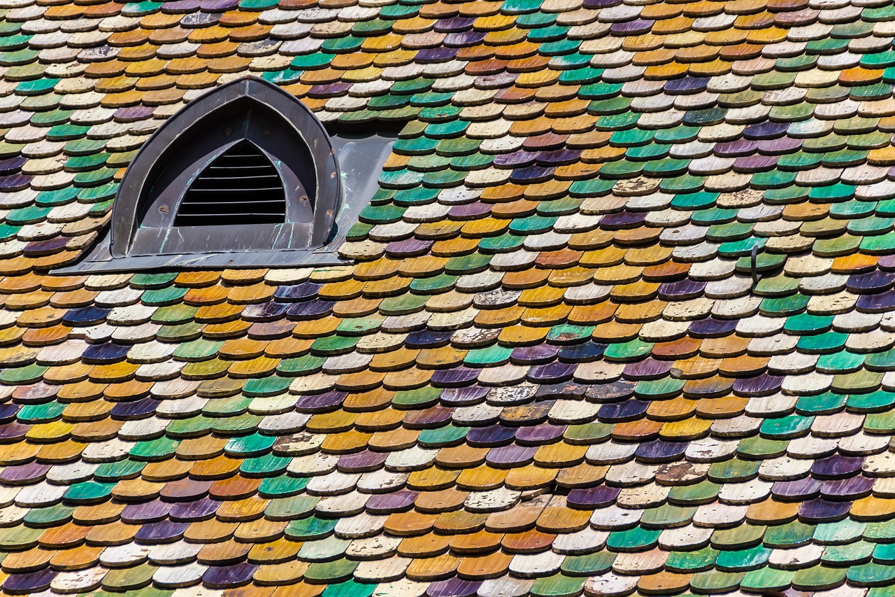 Close-up view of a double-layer asphalt shingle roof showing surface curling and telegraphing.
