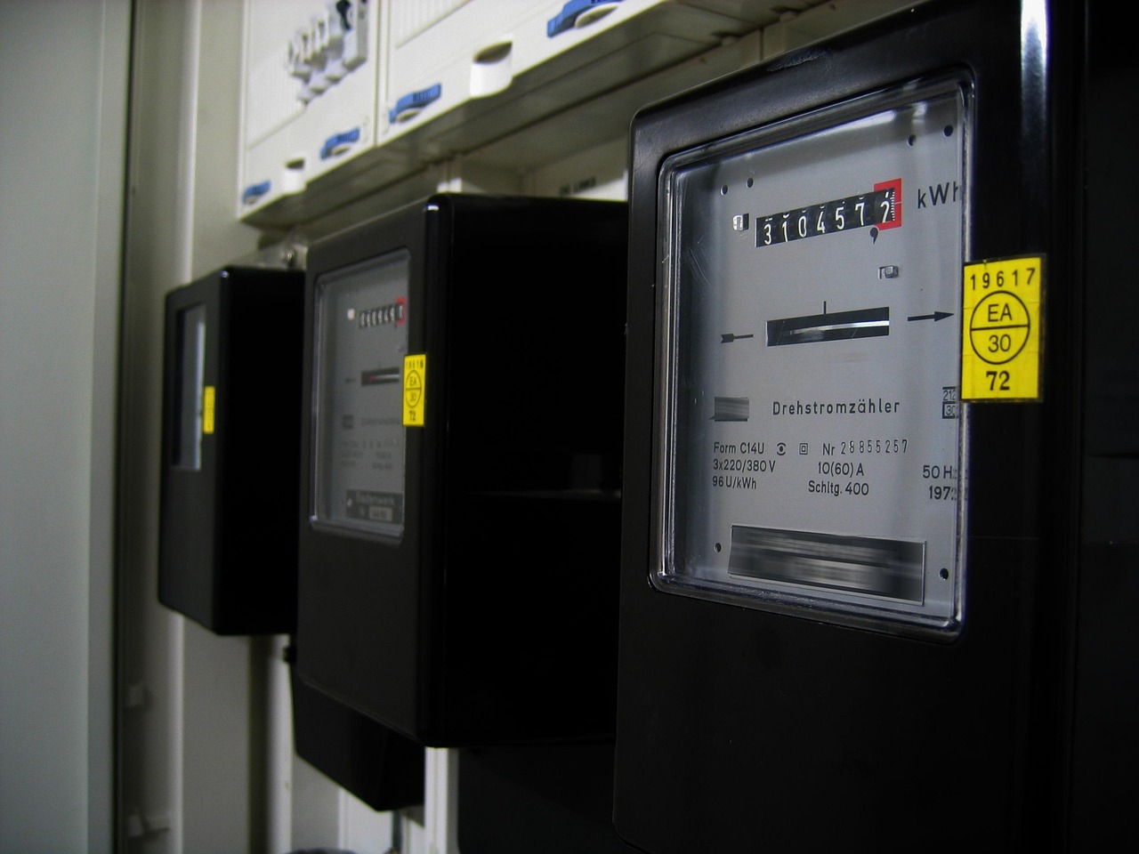 Digital residential smart electric meter tracking kilowatt-hour energy production and consumption.