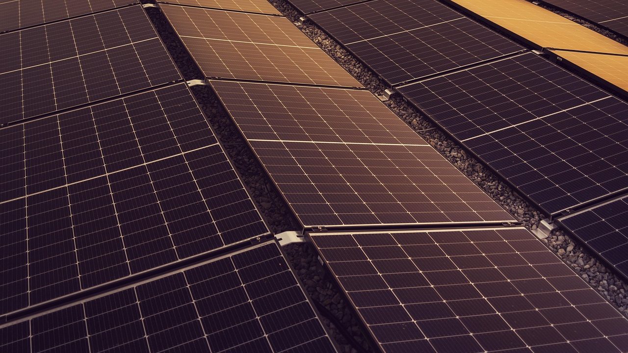 Suburban home equipped with rooftop solar panels and modern utility power grid connections.