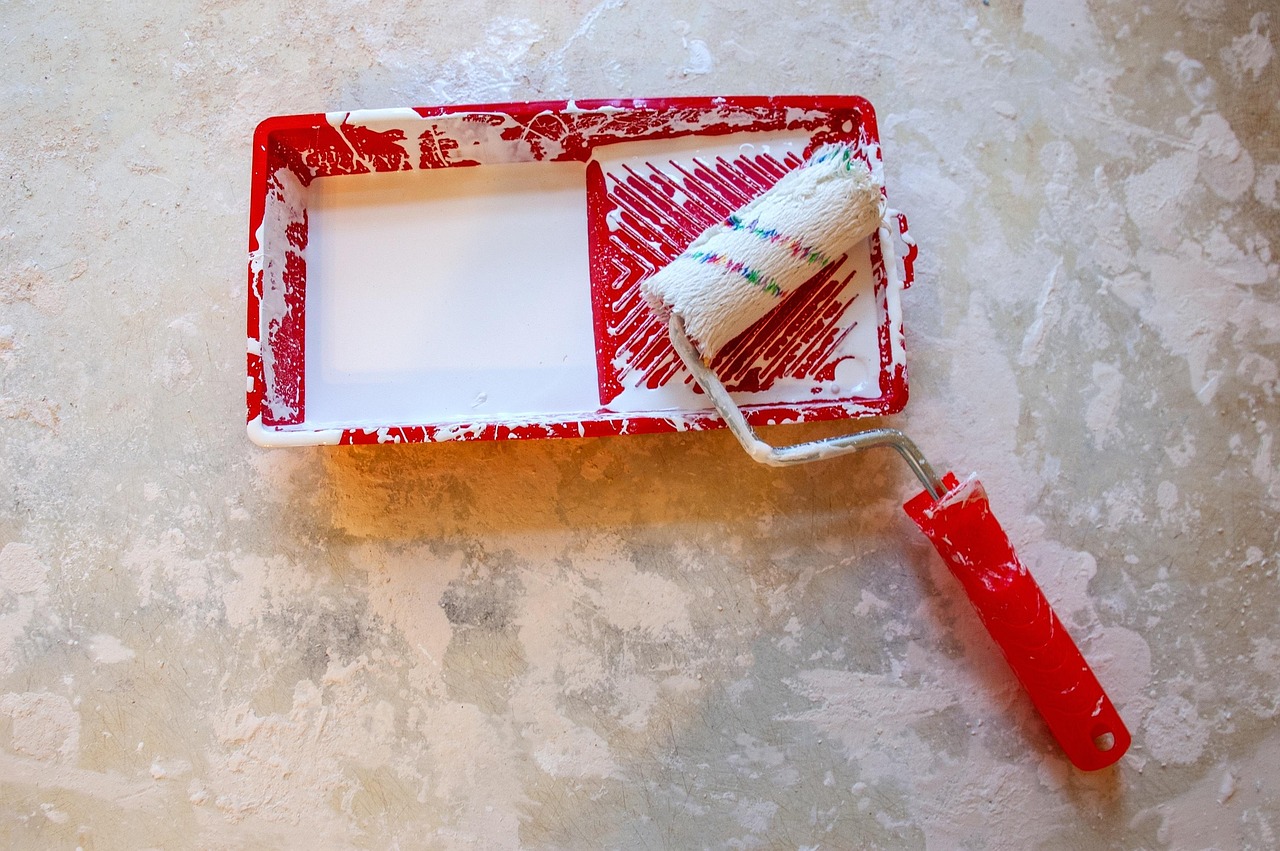 Basic hand tools and cleaning brushes used for residential maintenance tasks.