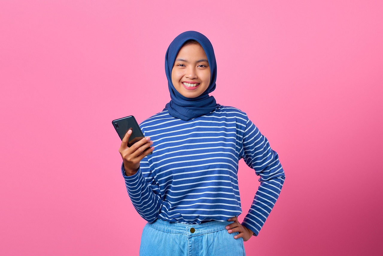 Teenager checking mobile banking app on smartphone
