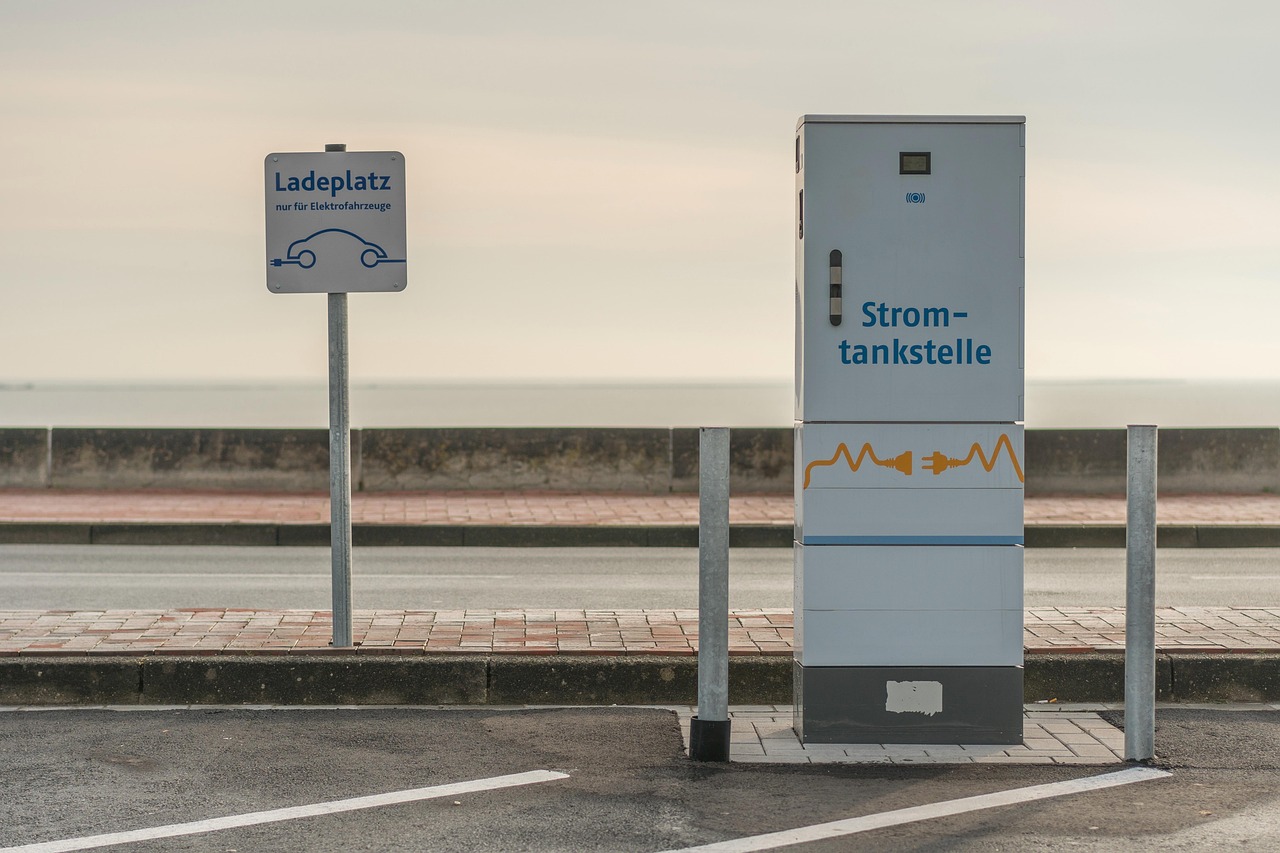 Electric vehicle plugged into a home Level 2 charging station in a garage