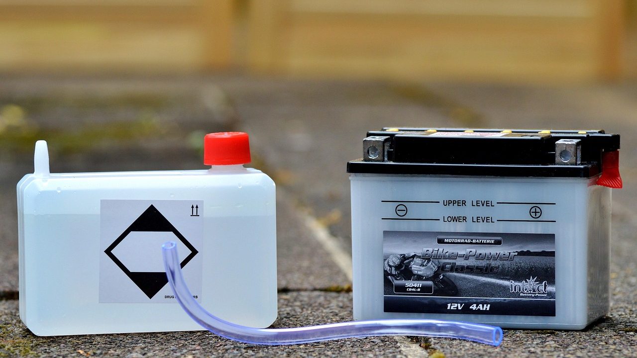 Mechanic performing a diagnostic check on an electric vehicle battery pack