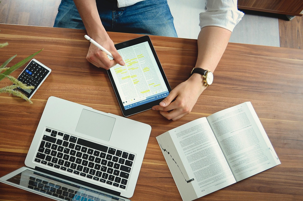 A digital tablet on a clean desk illustrating scanned envelope previews inside a secure online portal.