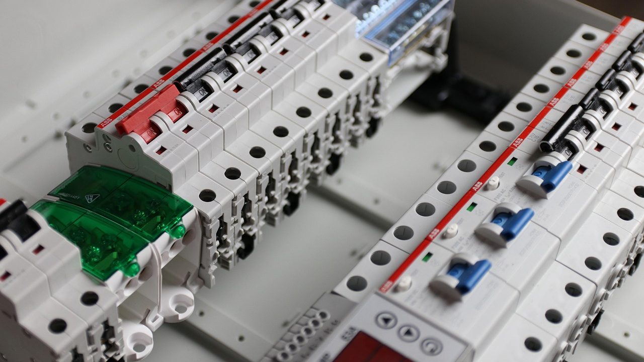 Electrician inspecting a residential electrical service panel