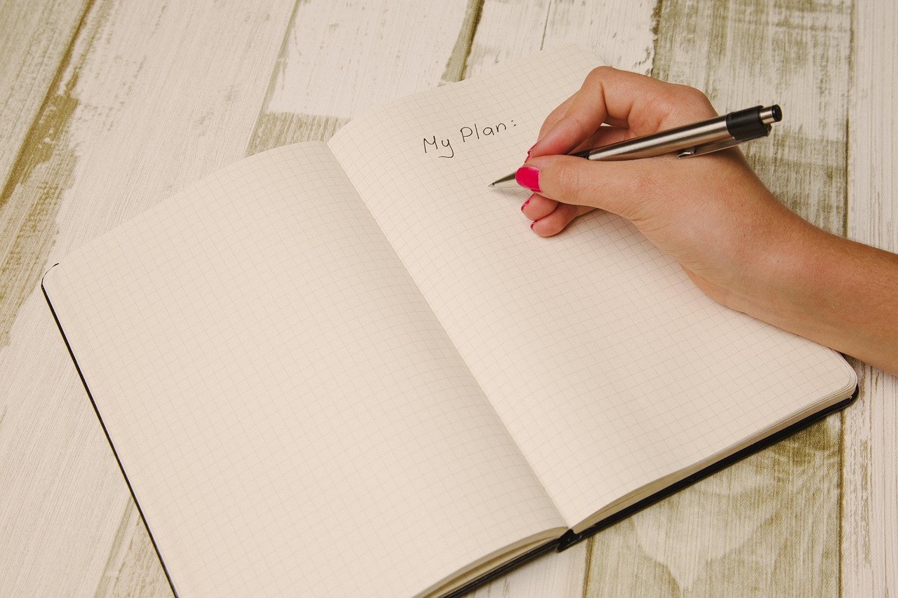 Organized expense management reports and financial planning papers on an office table.