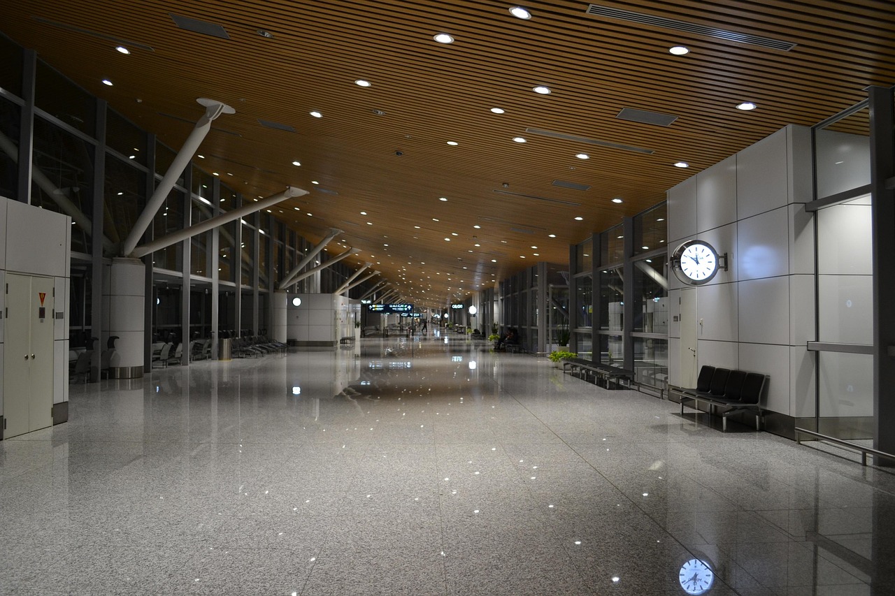 Traveler sitting in an airport terminal with luggage