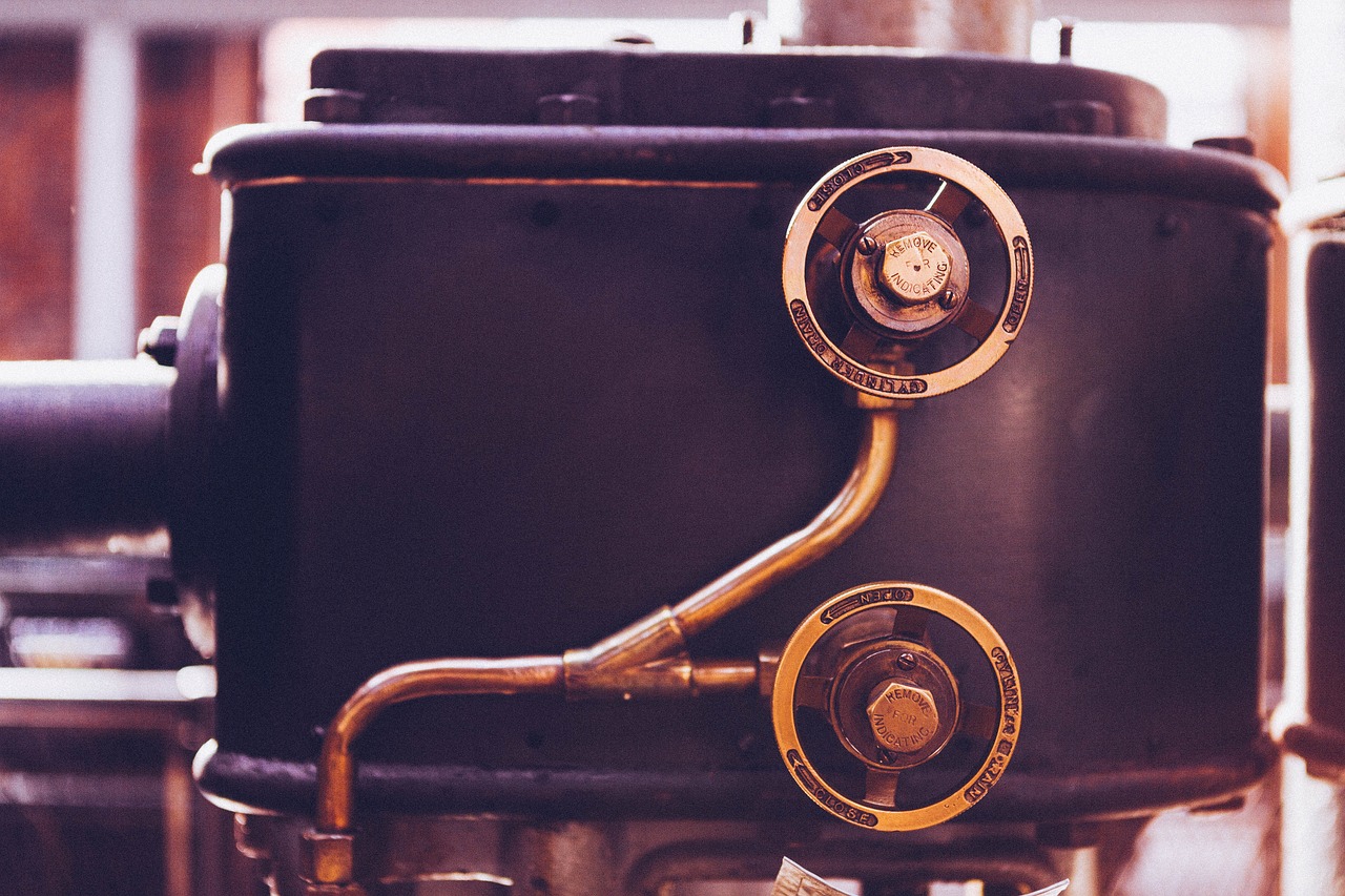 Close-up of copper piping and valves on a residential heating system.