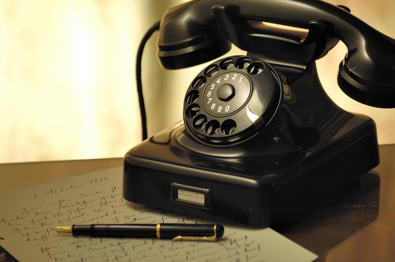 Small business owner negotiating with a bank representative on the telephone