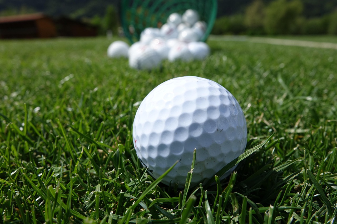 Close up of a golf professional inspecting a rubber club grip.