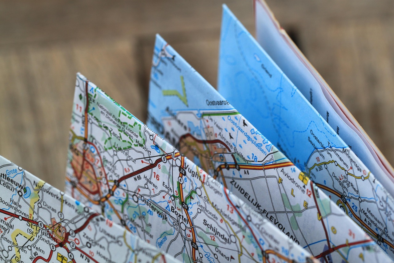 Parents reviewing a travel itinerary and campus map before a university visit