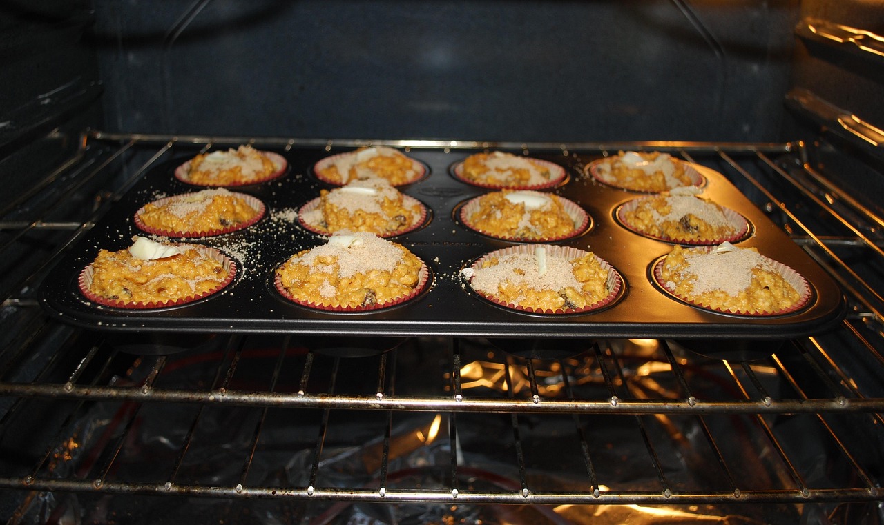 Countertop toaster oven heating food on a wire rack.
