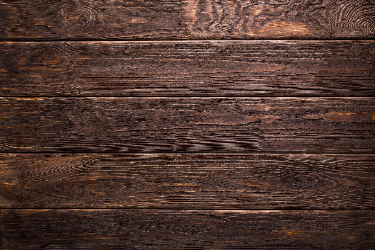 Wood stain color and opacity samples on a wooden board