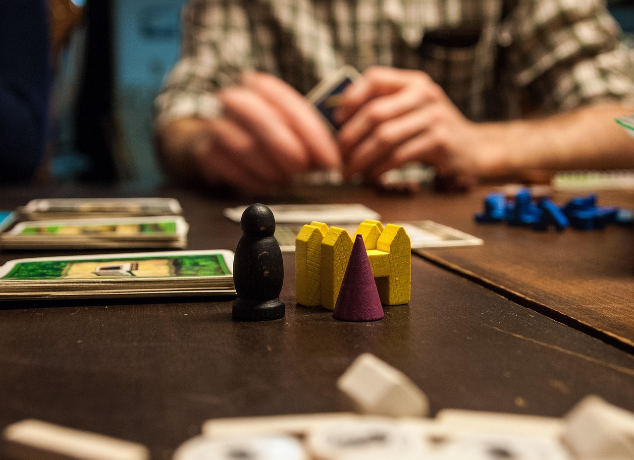 Family playing a board game together in the living room