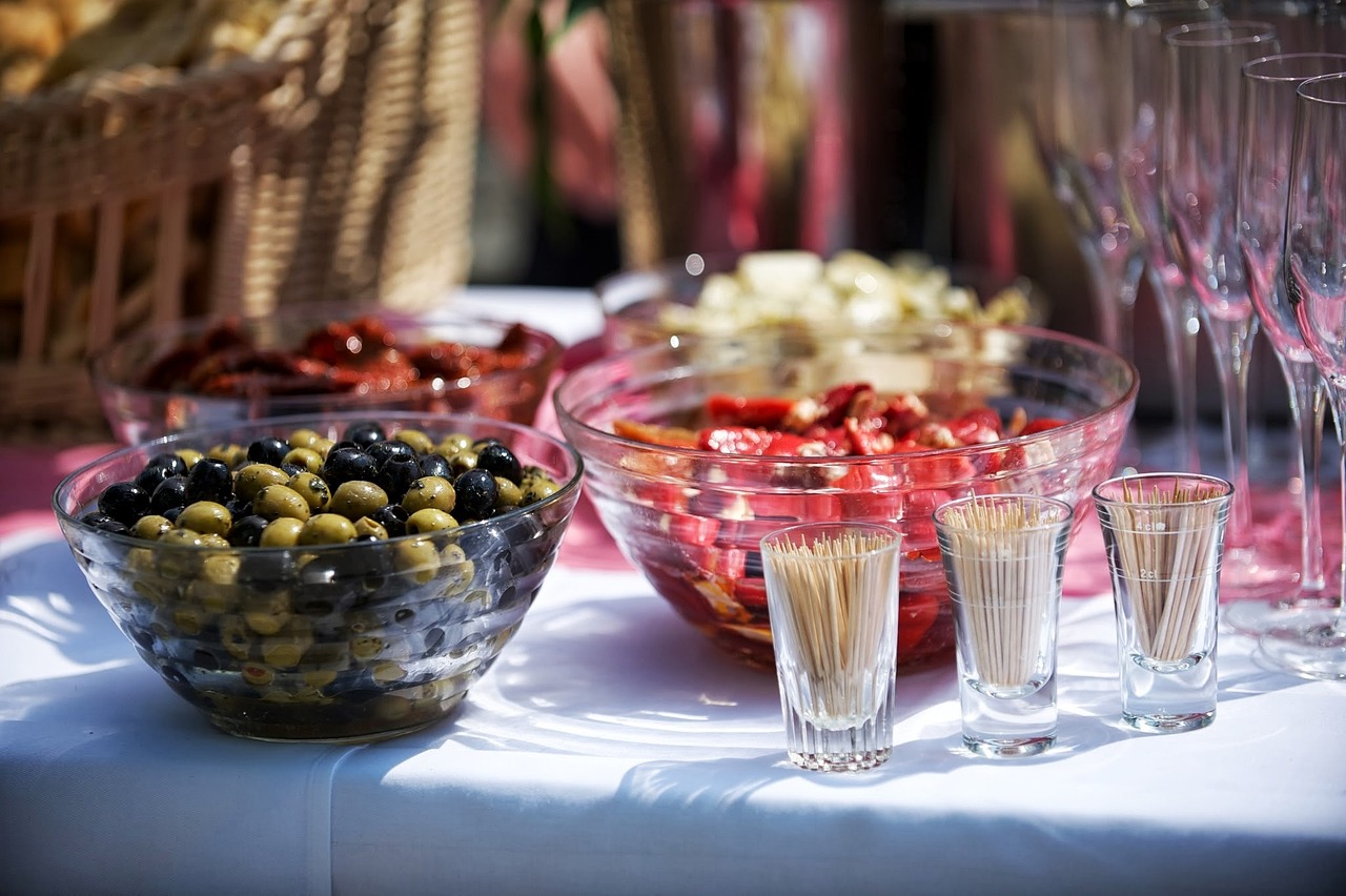 Catered food buffet table set up for a large family celebration.