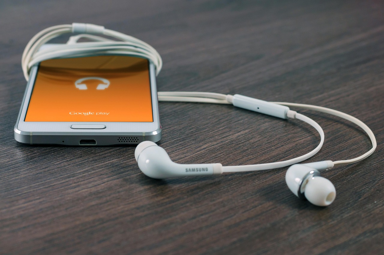 Close-up of a smartphone displaying music streaming subscription settings.