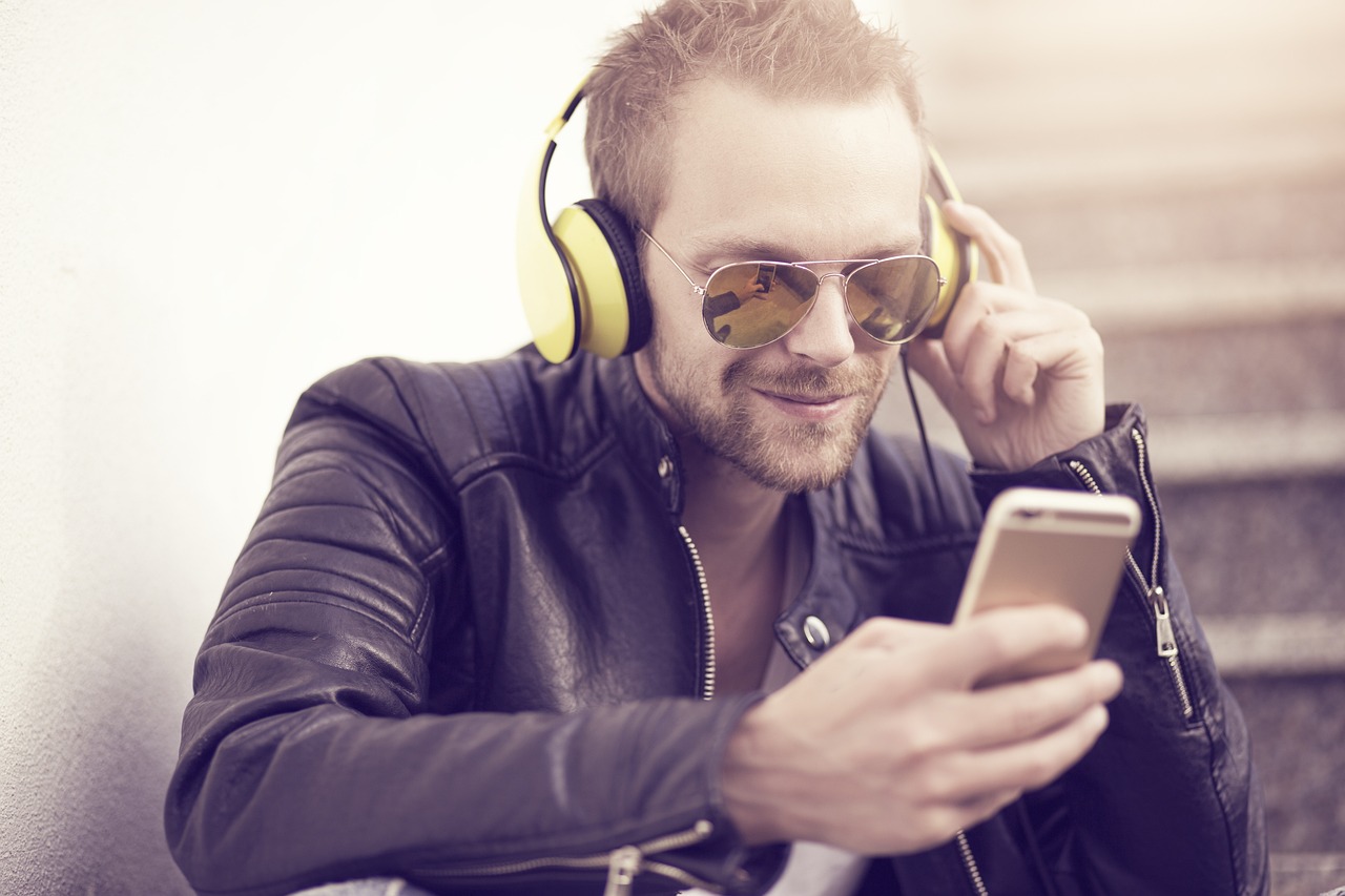 Close-up of a smartphone screen displaying podcast subscriptions and settings.