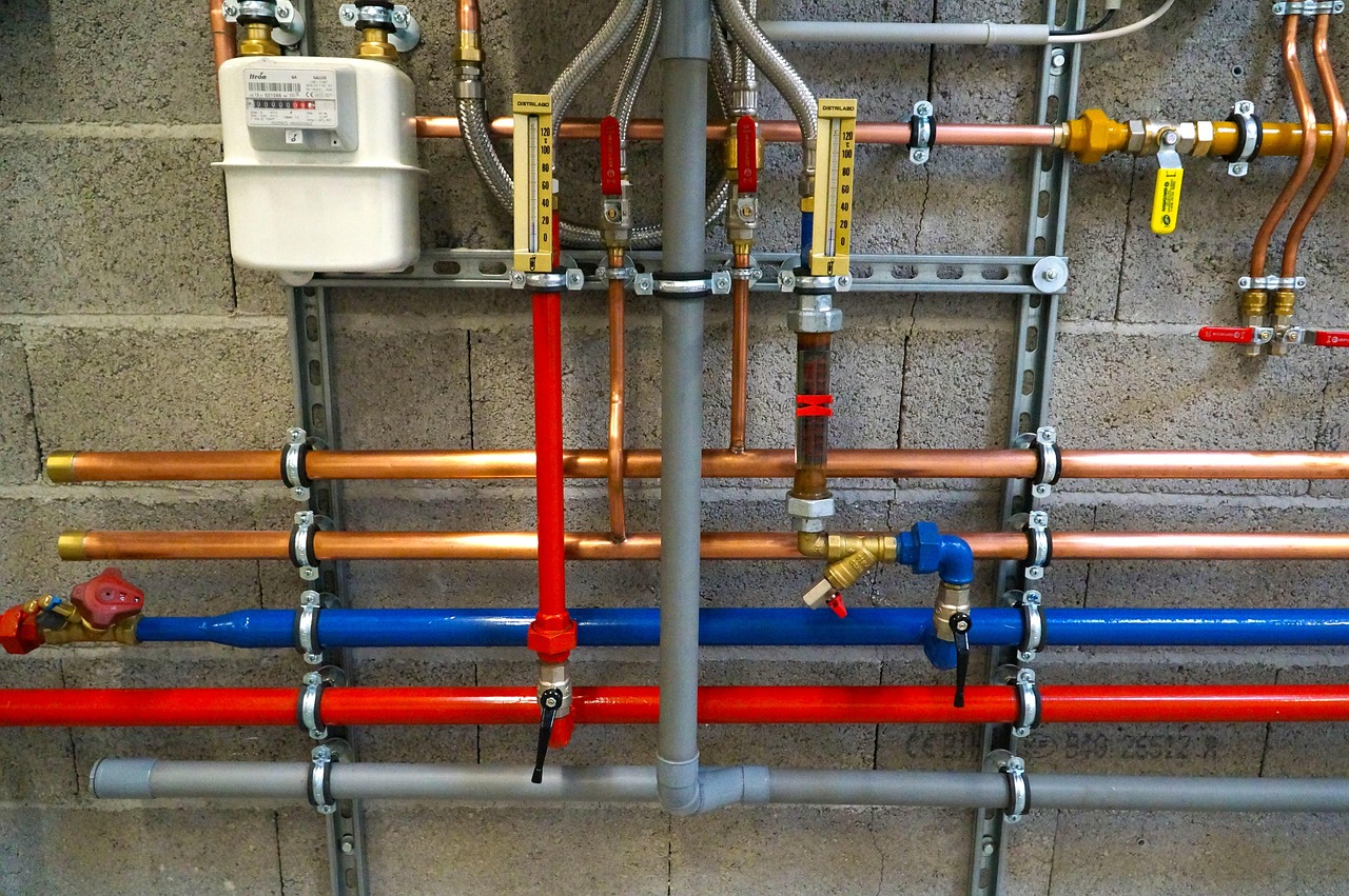 PEX plumbing and water supply lines installed underneath a small residential sink.