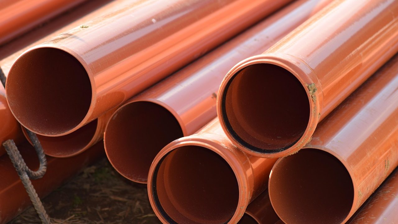 Plumber inspecting a residential sewer pipe connection
