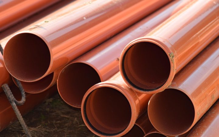 Plumber inspecting a residential sewer pipe connection