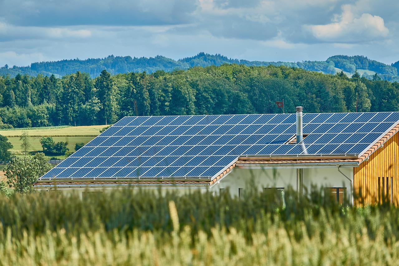 Close-up view of a solar mounting foot bolted to a roof shingle