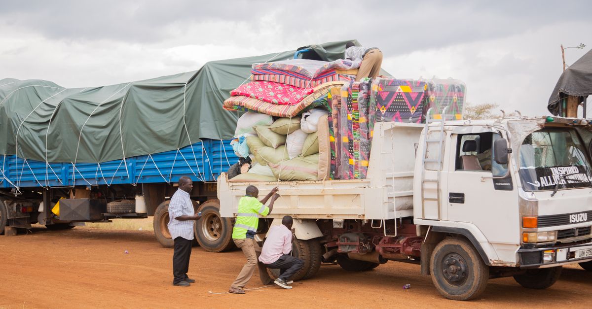 Building supplies loaded safely inside the open bed of a pickup truck.