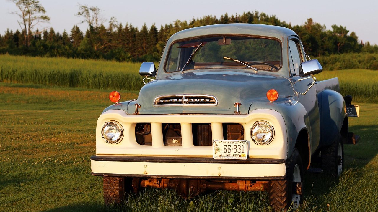 A clean pre-owned pickup truck parked on an outdoor dealership lot.