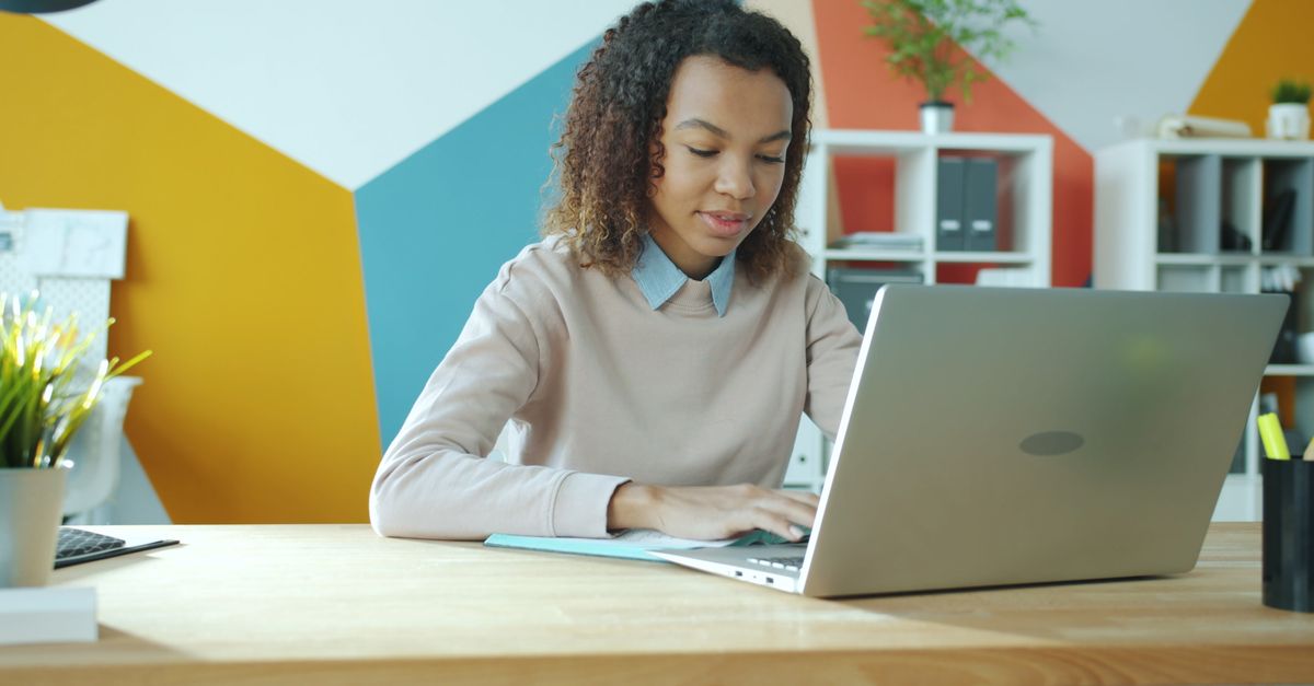 Woman managing online subscriptions on a laptop