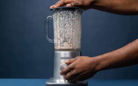 A powerful kitchen blender sitting on a modern kitchen countertop