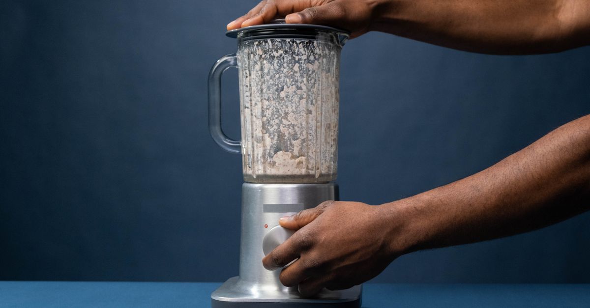 A powerful kitchen blender sitting on a modern kitchen countertop
