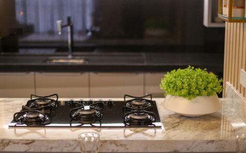 A sleek professional-style kitchen range installed in a modern home kitchen.