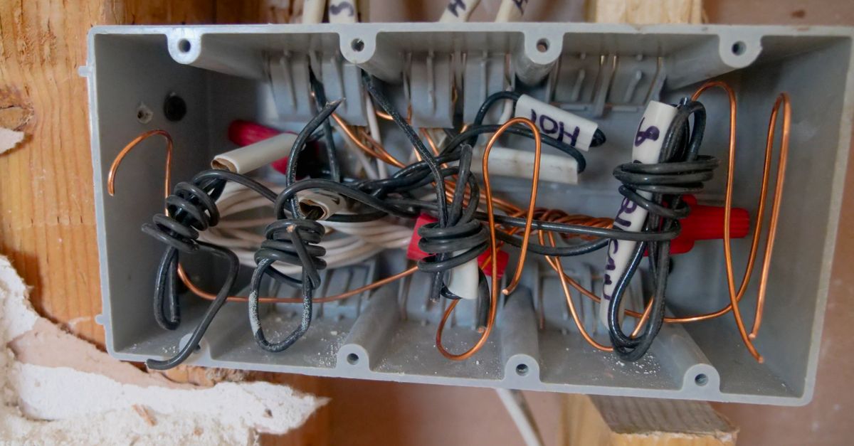 Open residential electrical panel showing clean wiring and breakers