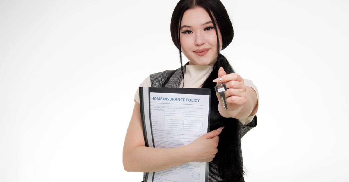 Homeowner reviewing insurance policy documents and coverage details at a desk