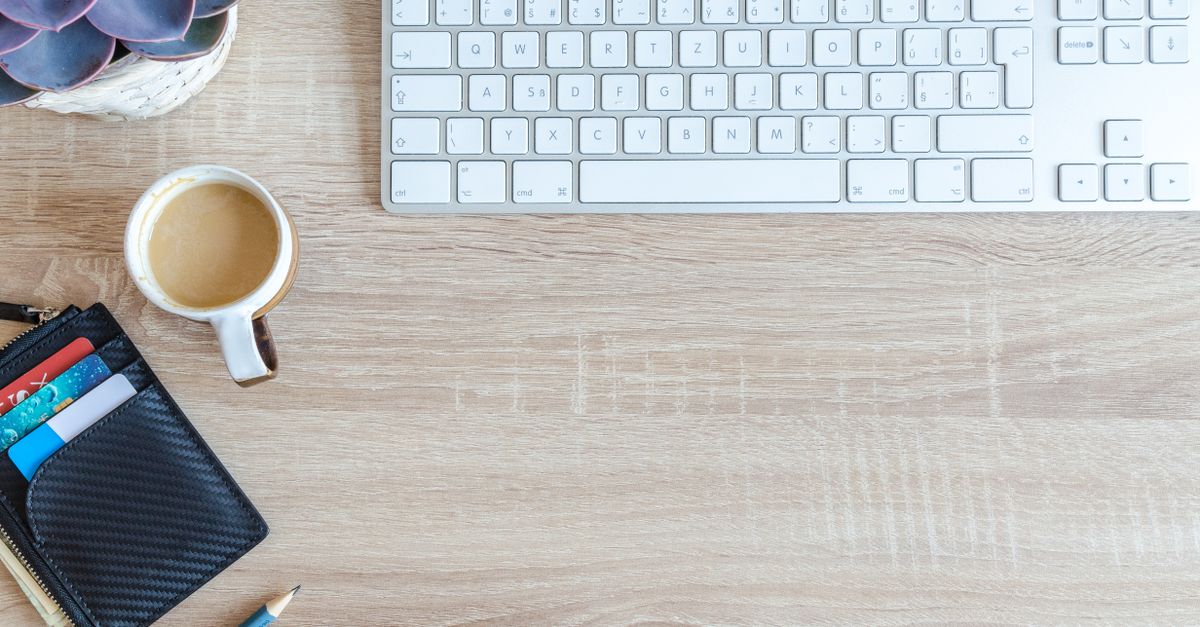 Minimalist office desk featuring a mechanical keyboard and a clean workspace