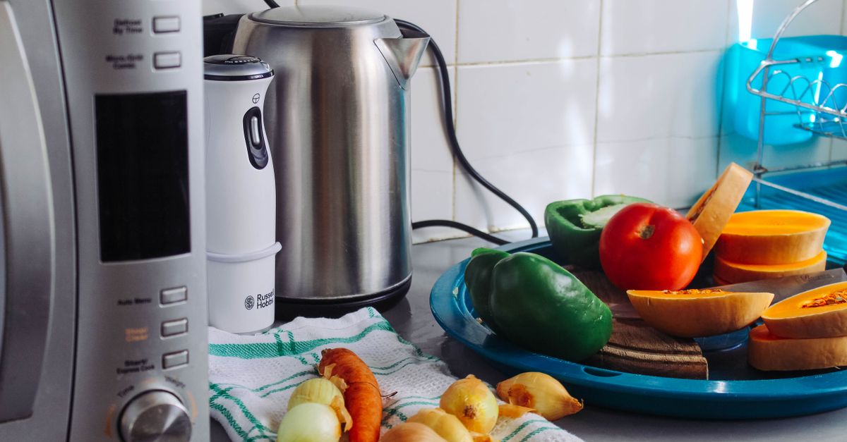 Various kitchen appliances organized on a countertop