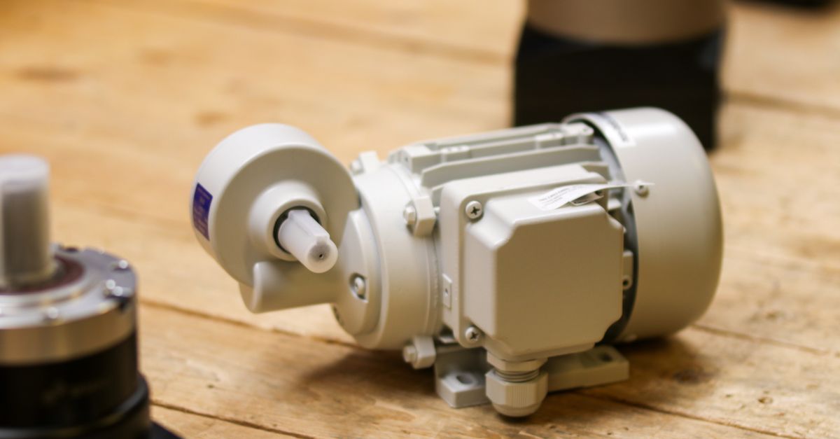 Electric motor and pump assembly on an air compressor