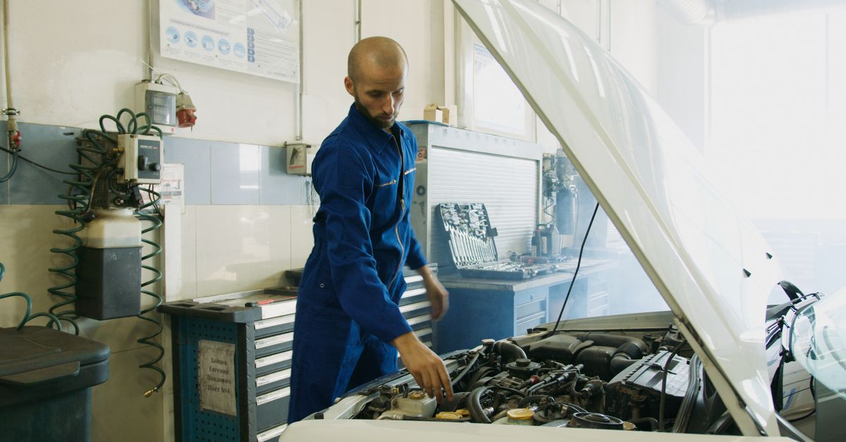 DIY mechanic working in a garage setting