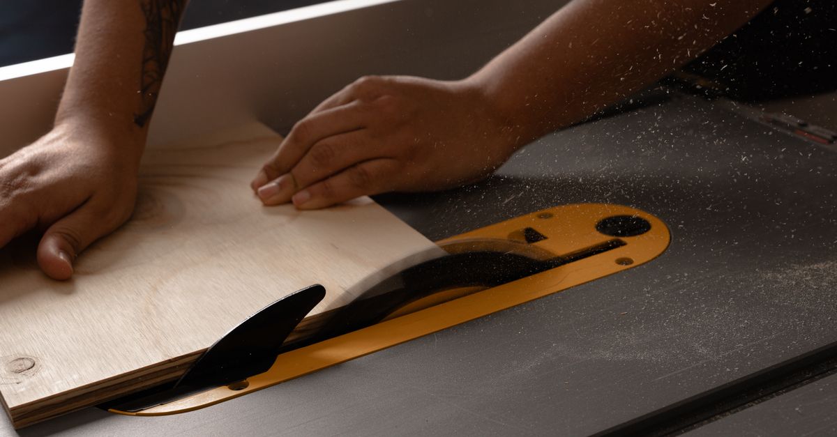 A workshop with a professional table saw ready for woodworking projects.