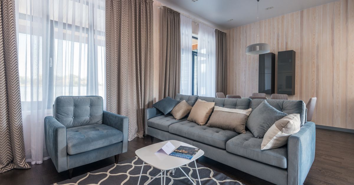 Heavy thermal curtains covering a large glass patio door.