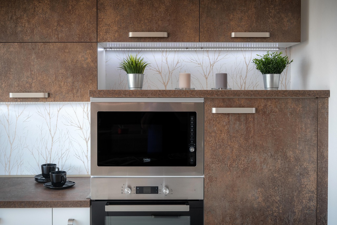 Sleek stainless steel built-in wall oven installed in a modern kitchen cabinet